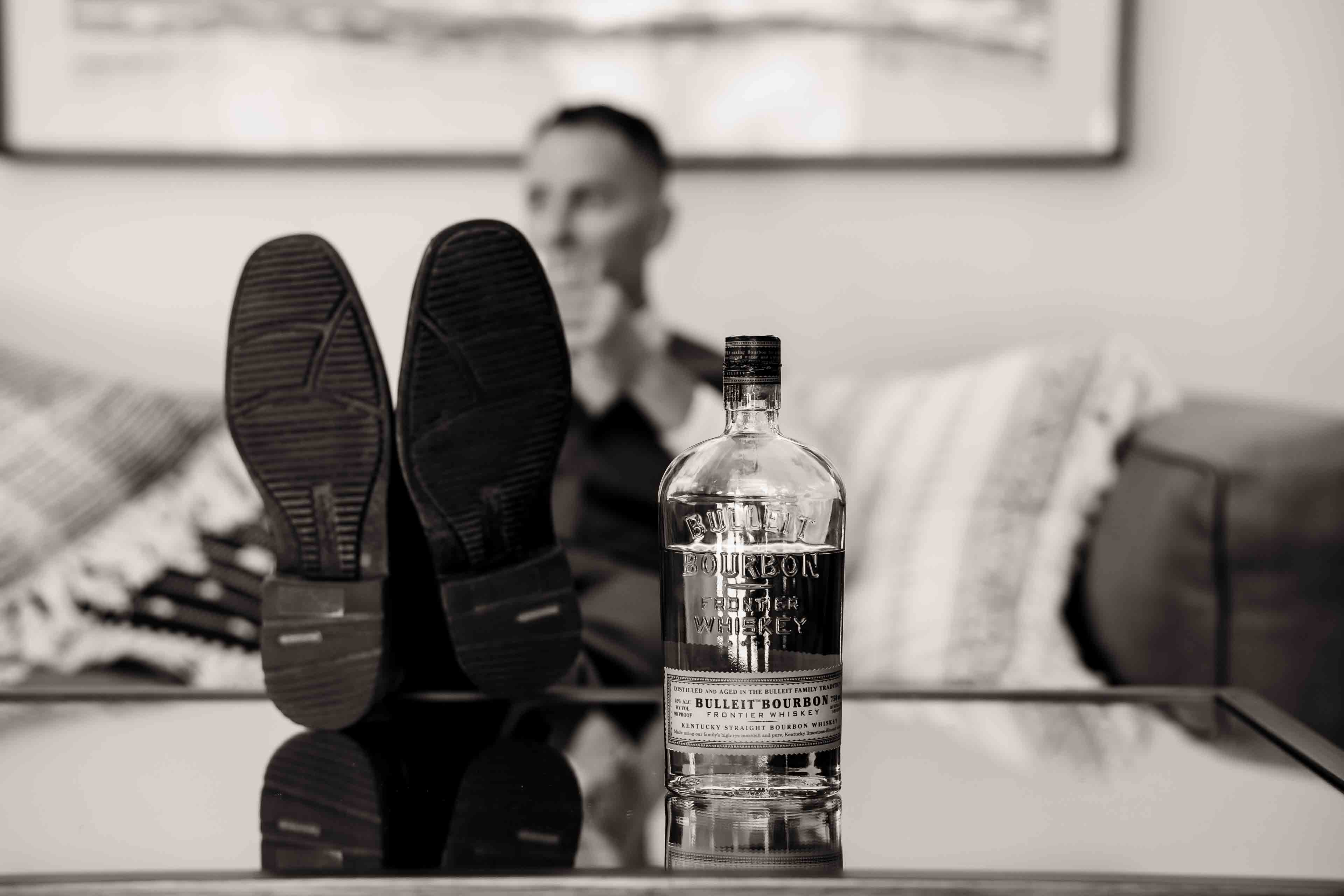 The Elm Estate Man with his feet on table relaxing in the billard room