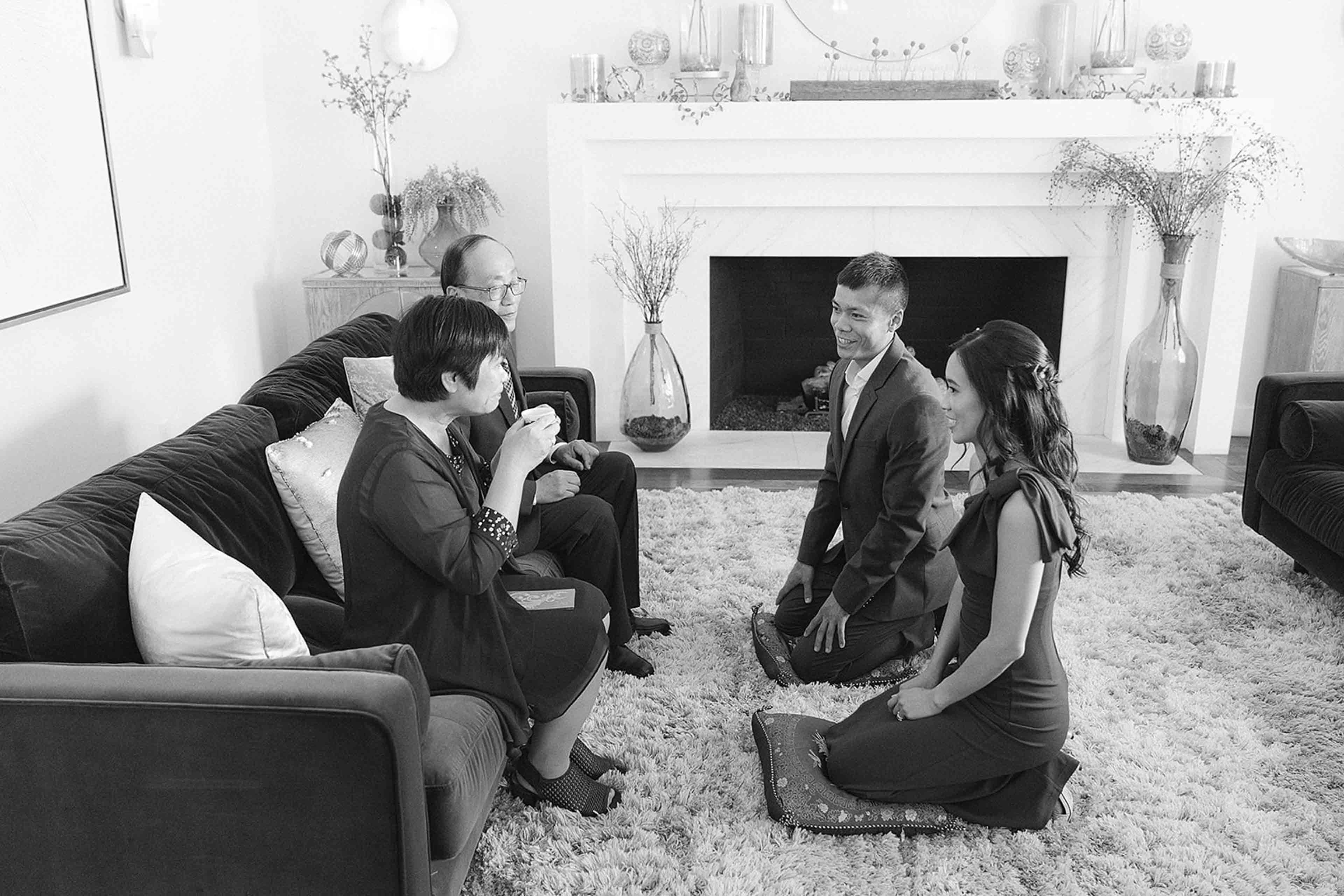 The elm estate family gathered in front of the fireplace