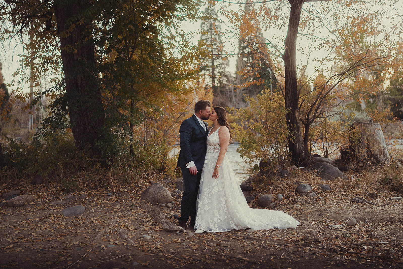 Autumn wedding kiss golden fall leaves romantic outdoor portrait seasonal backdrop