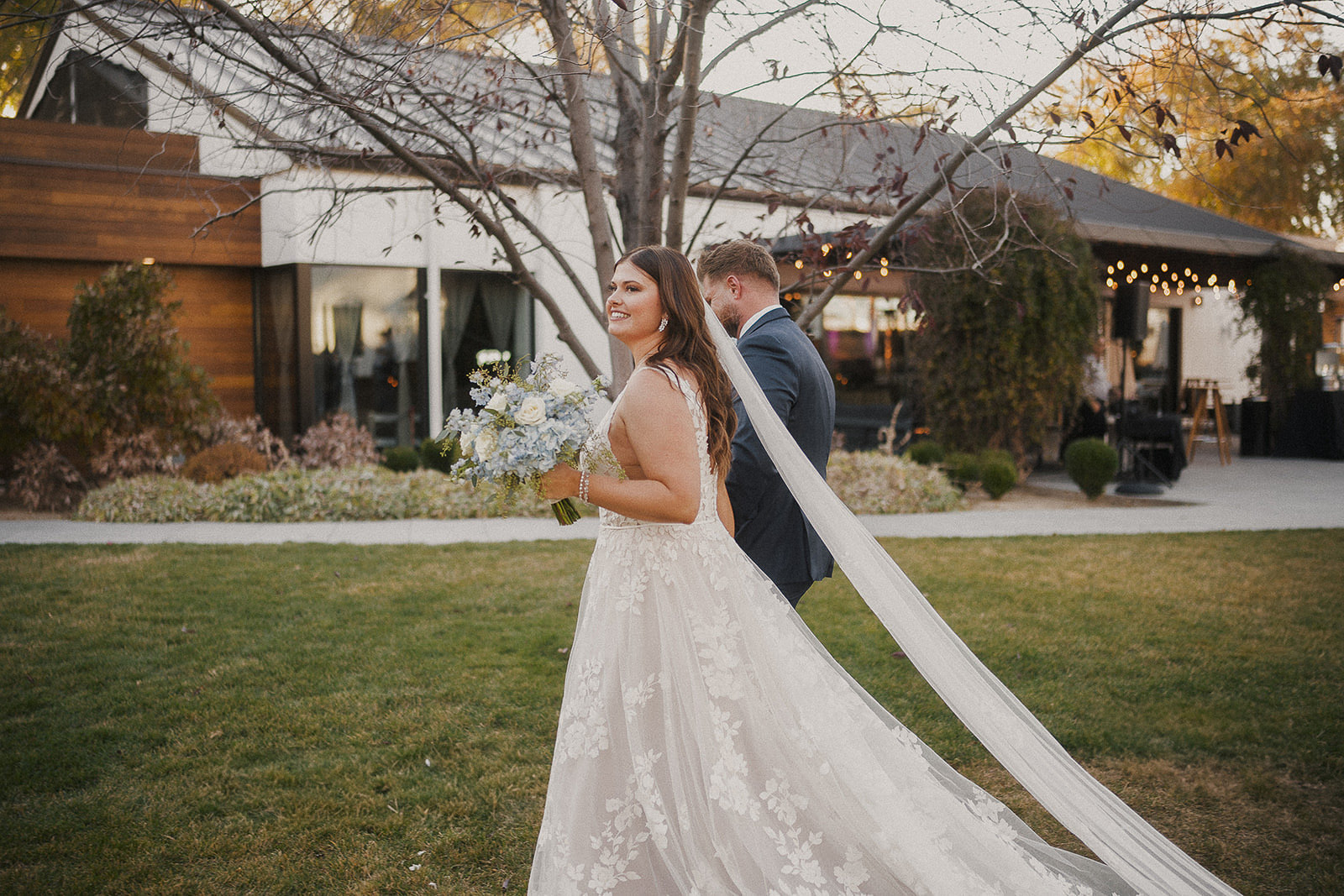 Fall wedding couple autumn foliage outdoor ceremony venue string lights decor