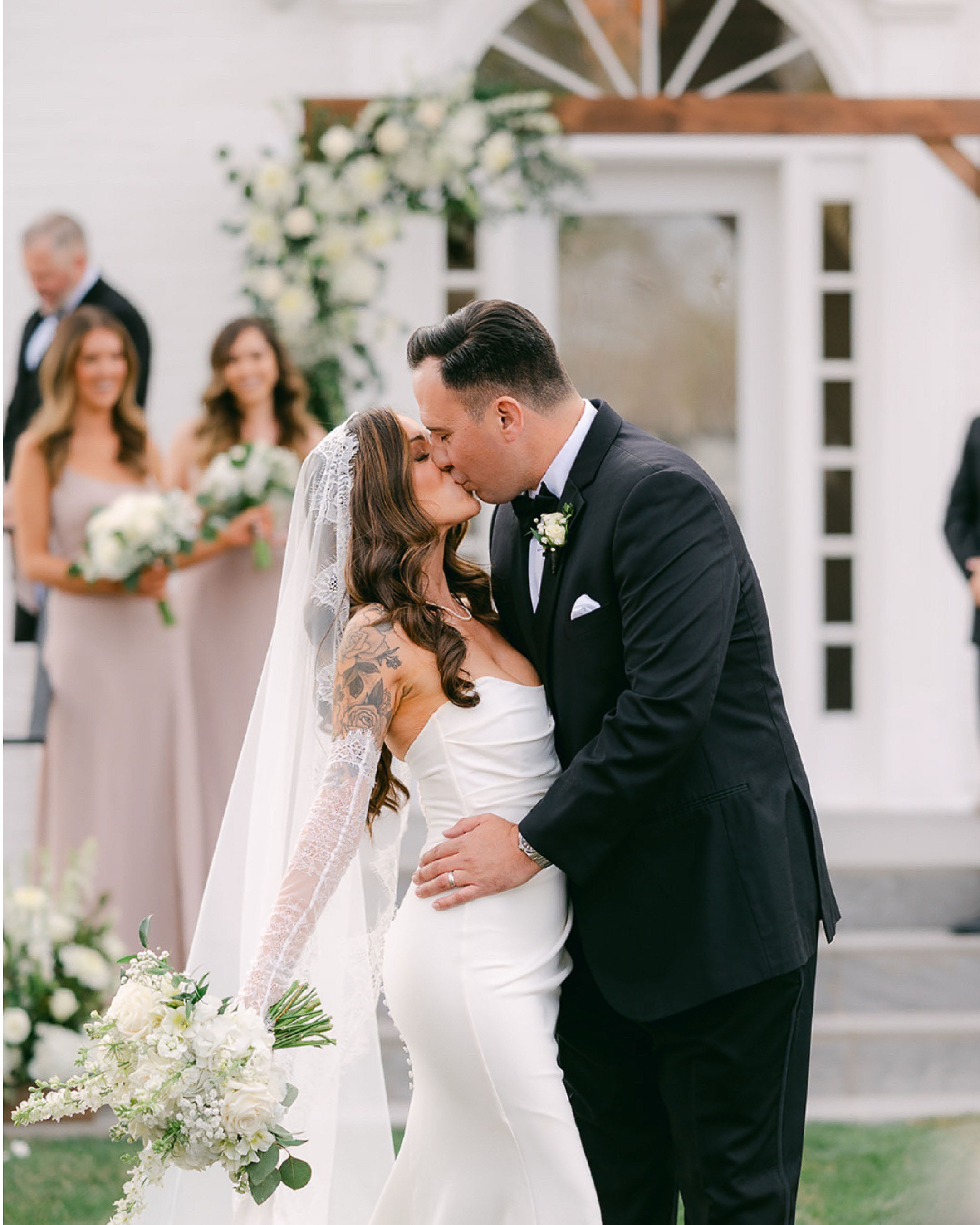 Real Wedding Couple Kissing at The Aisle at The Elm Estate